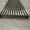 Stainless steel linear grate passing car