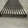 Stainless steel linear grate passing car