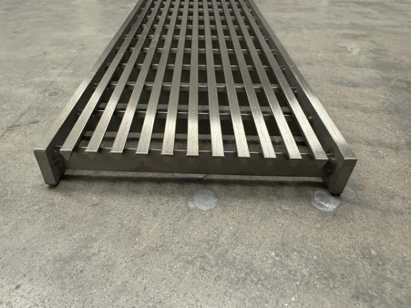 Stainless steel linear grate passing car